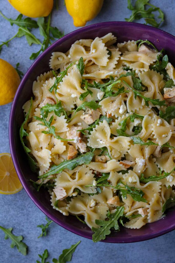 lemon arugula pasta salad in bowl 