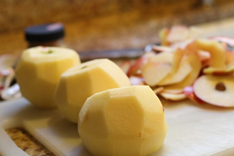 peeled apples on chopping board