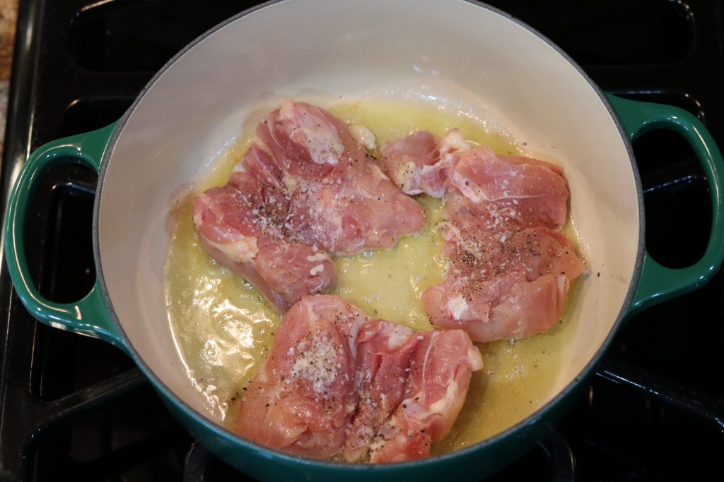 raw chicken in pan
