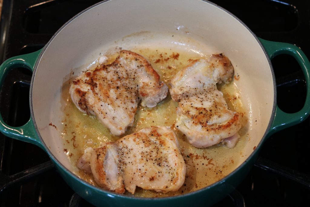 browned chicken in pan
