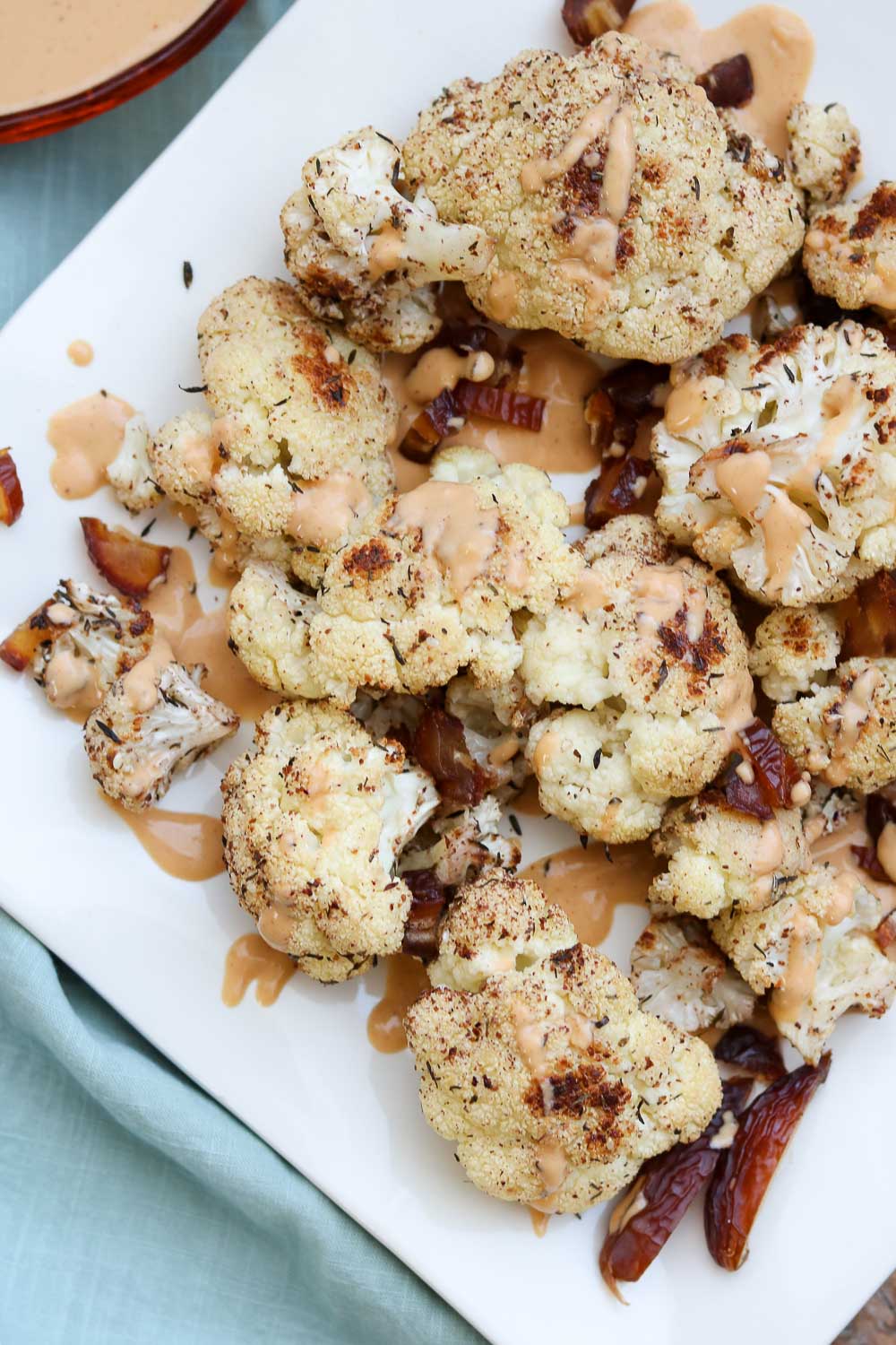 Roasted Za'Atar Cauliflower with Golden Tahini Harissa sauce Claudia's Table