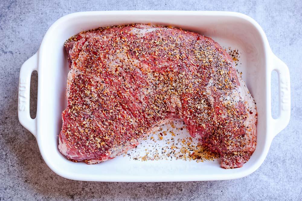 tri tip with seasoning in dish