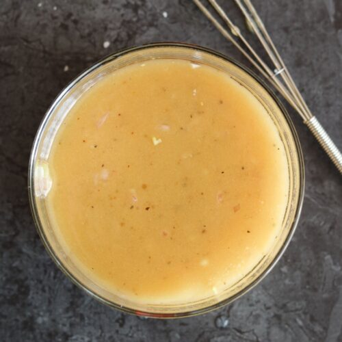white balsamic honey mustard dressing combined with whisk