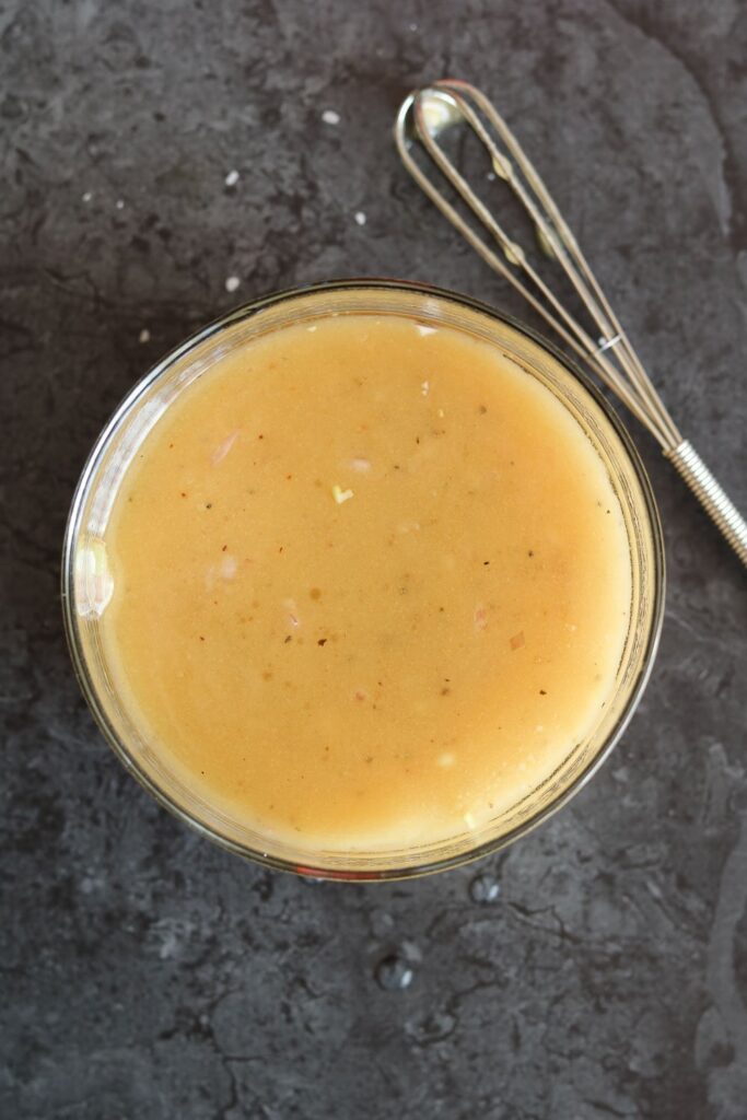 white balsamic honey mustard dressing combined with whisk
