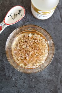 shallot soaking in vinegar in bowl with tablespoon