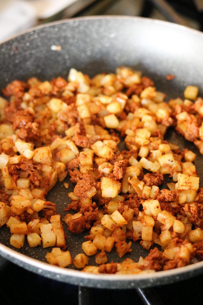chorizo and potatoes, onions in skillet