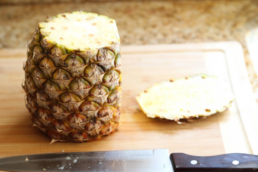 cut skin off pineapple