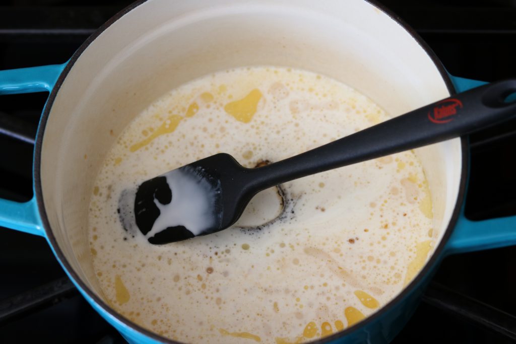 butter sugar whipping cream and rum in pot 