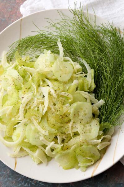shaved fennel salad plated with fennel fronds