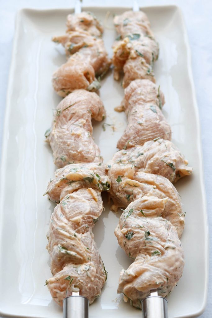 raw chicken on skewers ready for grill