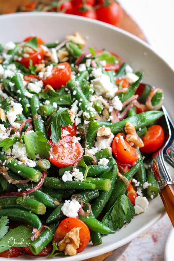 simple green bean tomato salad in beige bowl 
