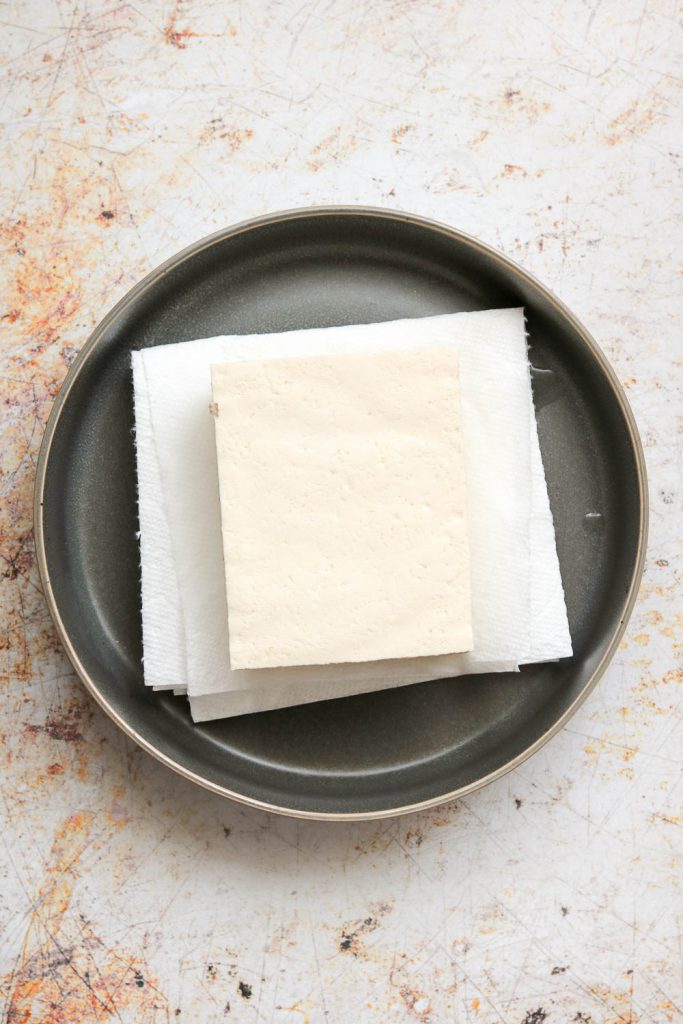 cube of tofu for spicy korean style tofu bowls