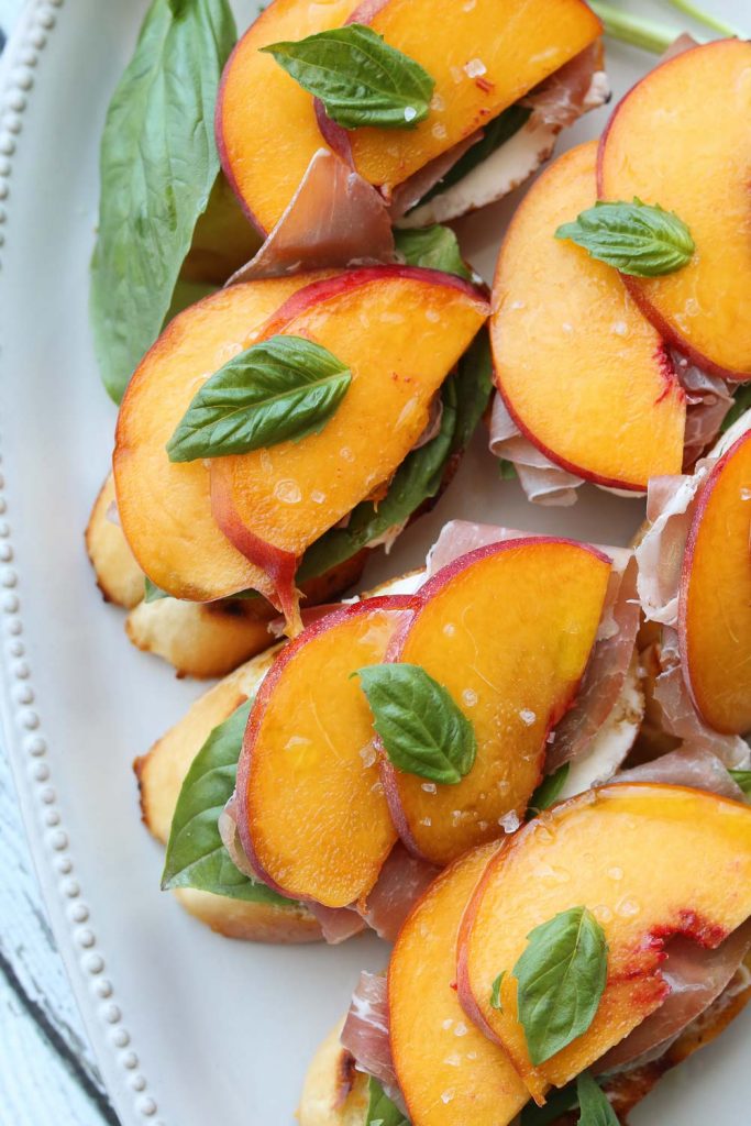 peach prosciutto mascarpone crostini close up