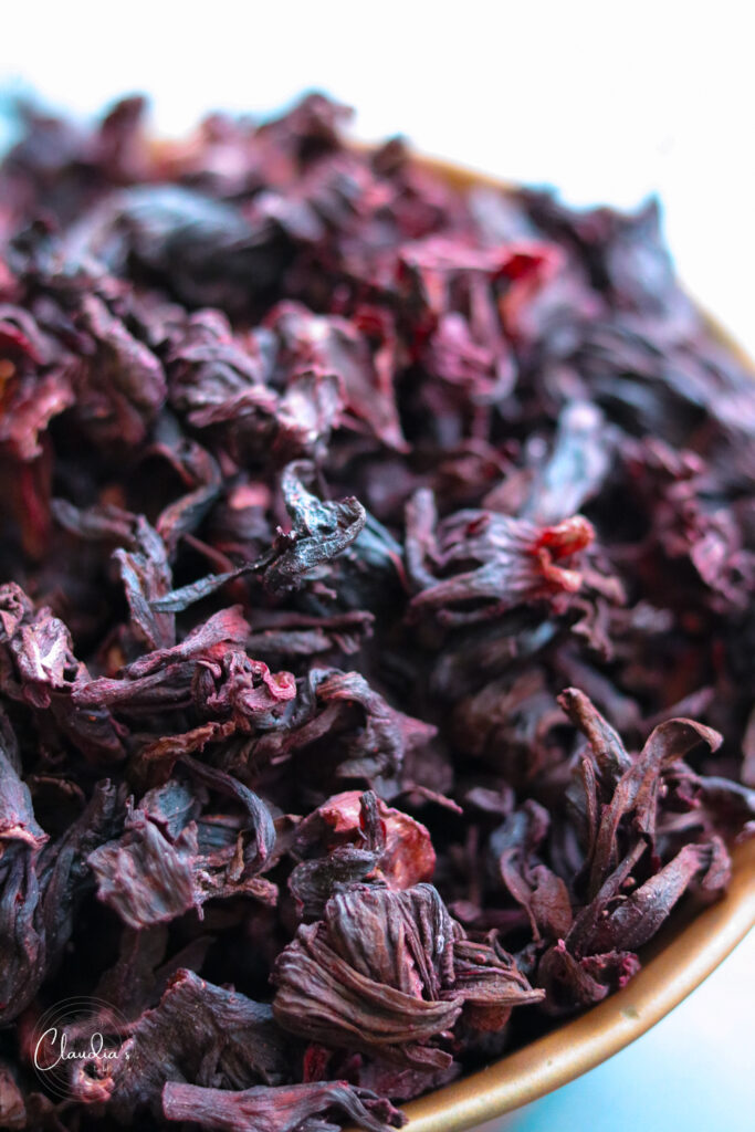 dried hibiscus flowers in copper kettle 