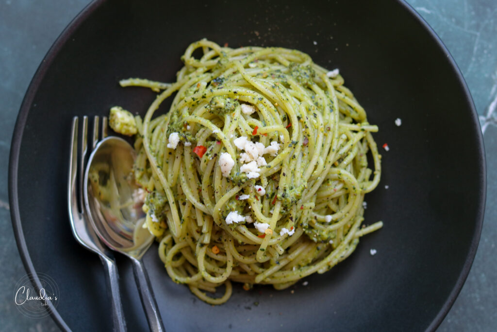 horizontal kale pistachio feta pesto in black bowl