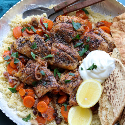 horizontal one pan chicken zaatar with carrots and currants