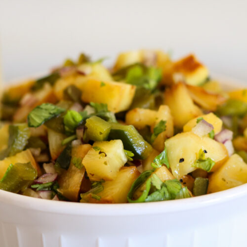 grilled pineapple jalapeno salsa in white bowl