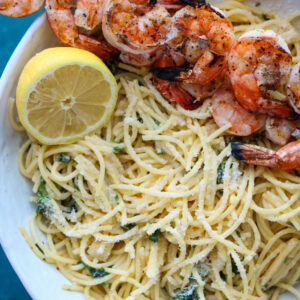 square photo of roasted garlic spaghetti with grilled shrimp