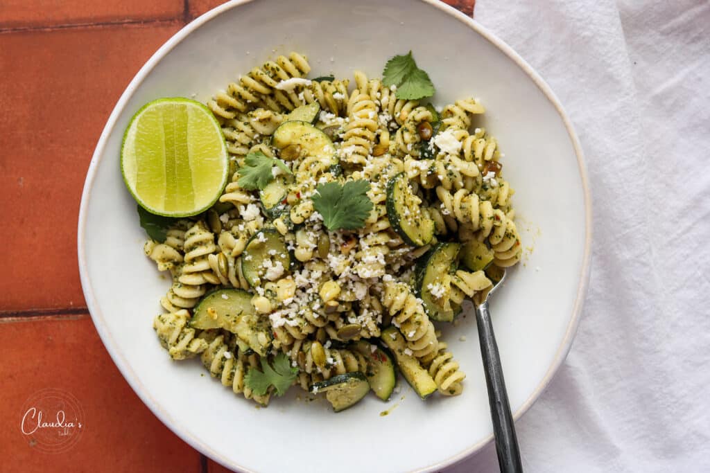 horizontal bowl of cilantro pesto pasta