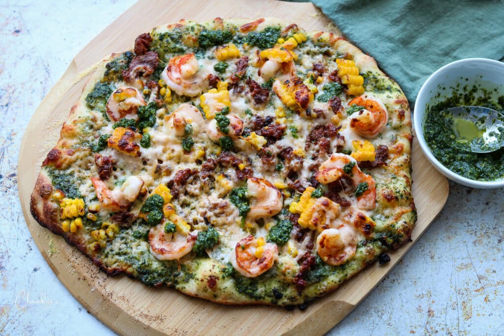 horizontal image of homemade chorizo and shrimp pizza 