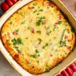 square image of frittata with asparagus in square baking dish