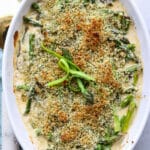 square image of baked asparagus with gruyere cheese sauce