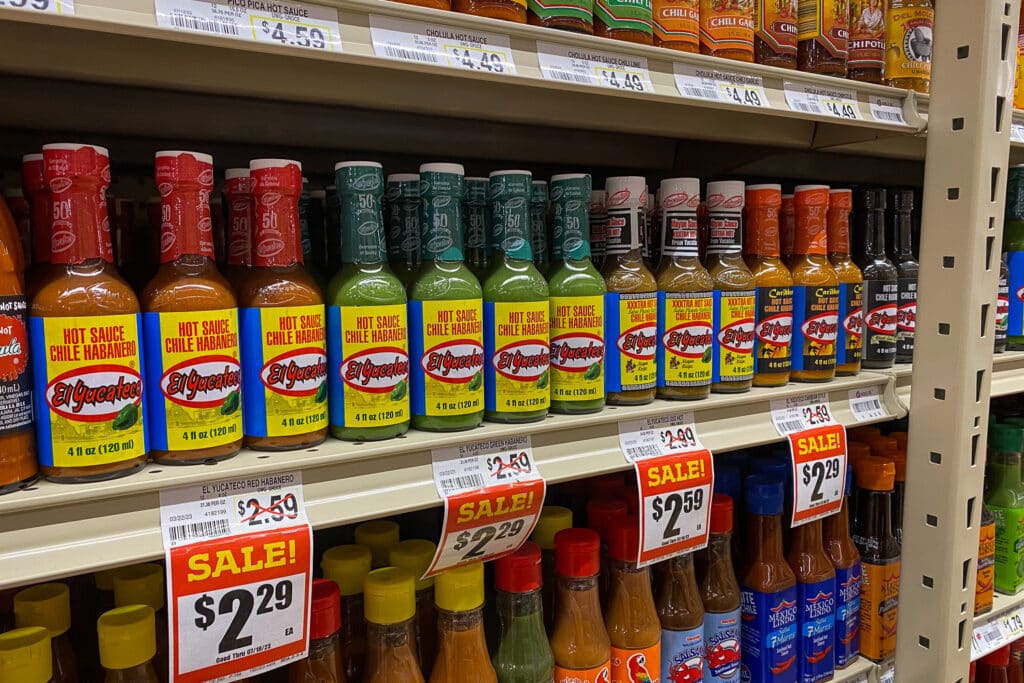 variety of El Yucateco hot sauces on store shelfs