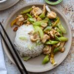 square photo of almond chicken stirfry with steamed rice