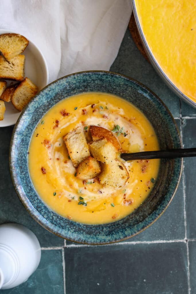 roasted butternut squash soup with crouton, bacon pieces and a touch of cream.