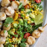 square image of spicy grilled scallops with corn, avocado, tomatoes
