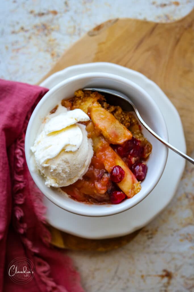 crumble in bowl with vanilla ice cream and napkin 