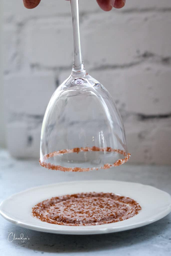 twirl glass rim into sugar or salt 