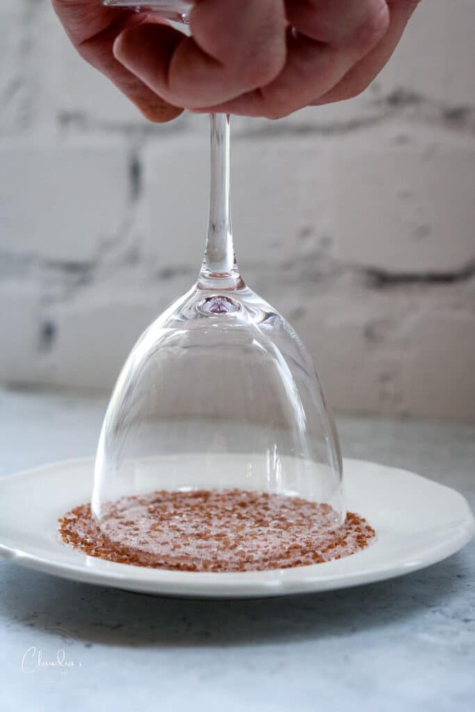 dip glass rim into sugar or salt 