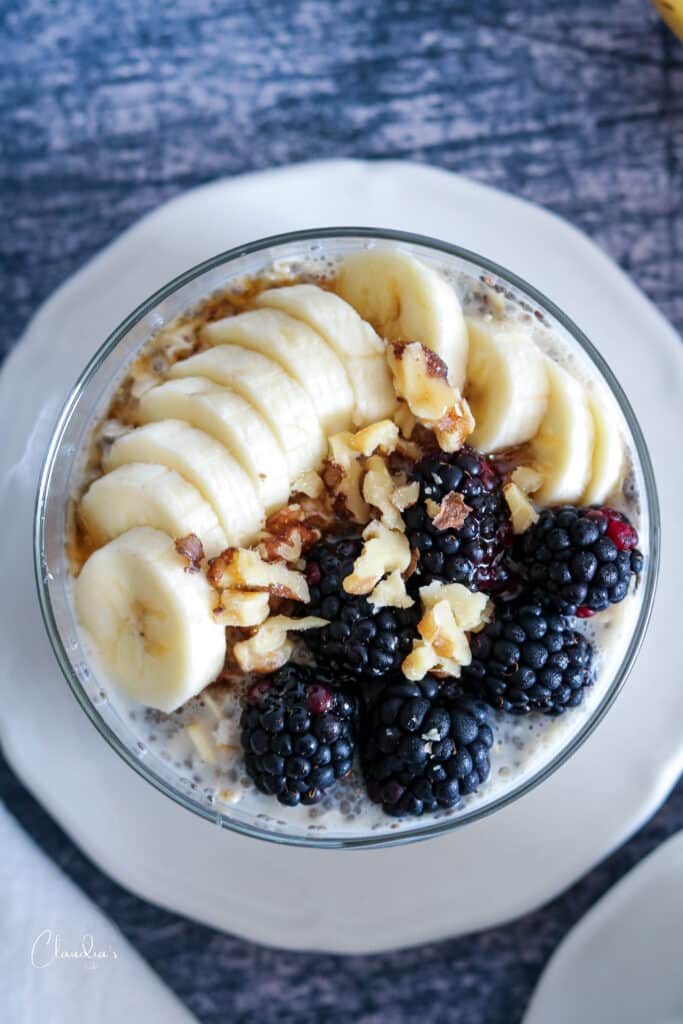 overnight oats with bananas, blackberries, nuts and maple syrup