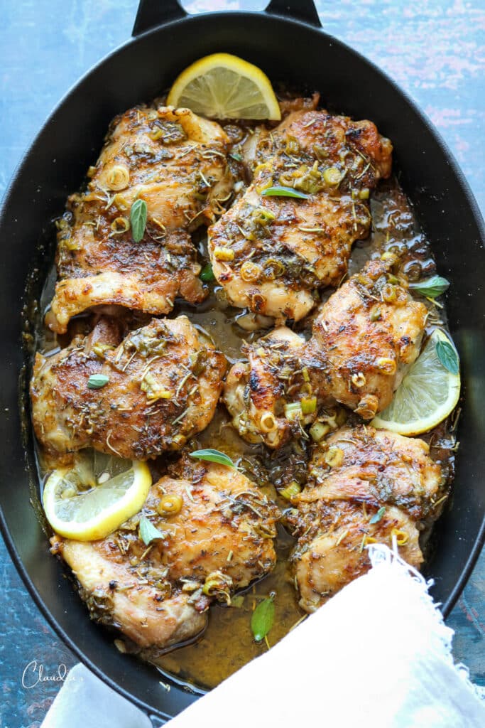black cast iron pan with chicken thighs 