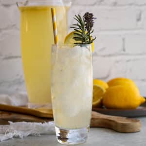 Lavender lemonade in tall glass with ice