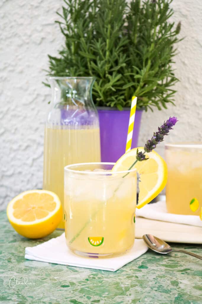 Refreshing Lavender Lemonade with Homemade Lavender Syrup garnished with fresh lavender.