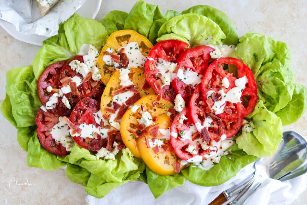 BLT salad on platter with blue cheese on the side
