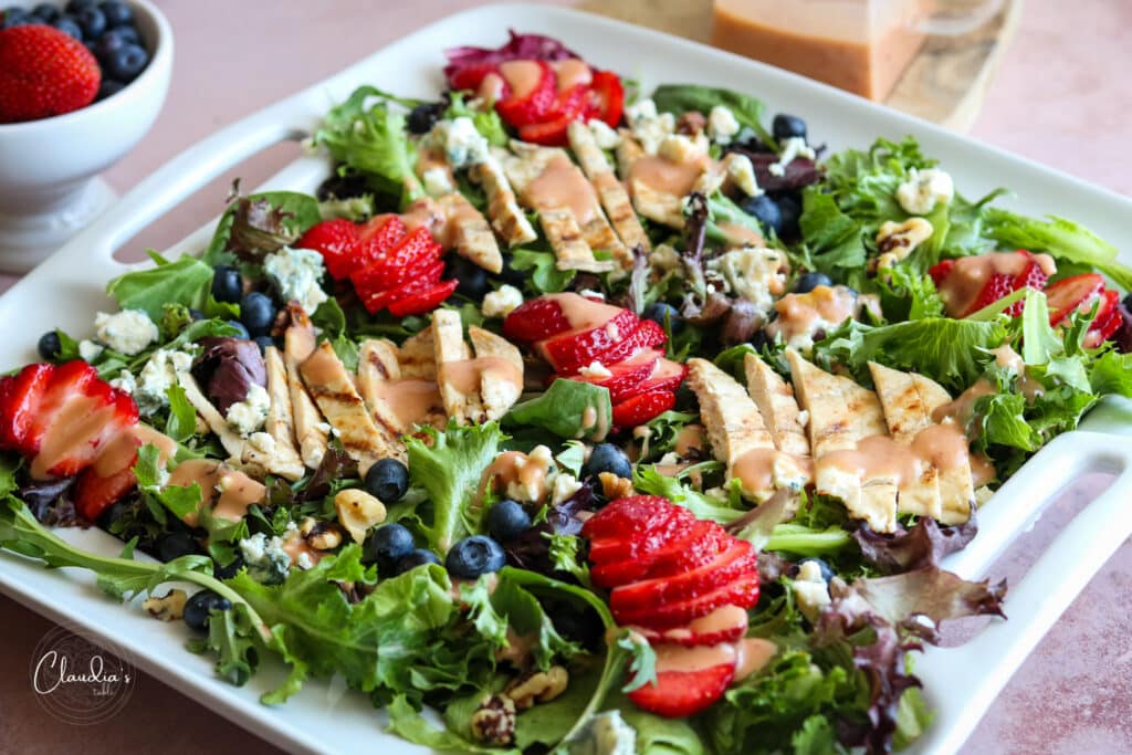 platter with summer berry salad with creamy berry vinaigrette