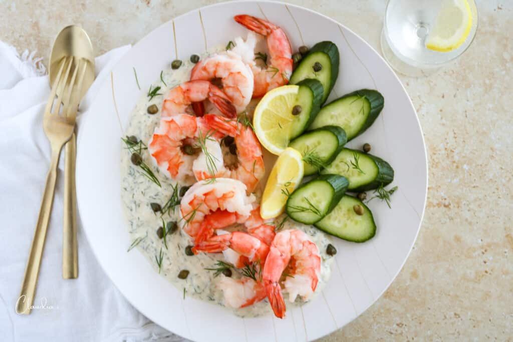 chilled shrimp plate with yogurt dill dressing cucumbers capers and fresh dill