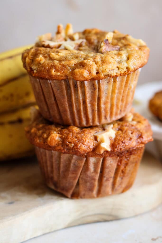 banana and oat muffins stacked 