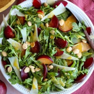 square image of plum salad with manchego and marcona almonds
