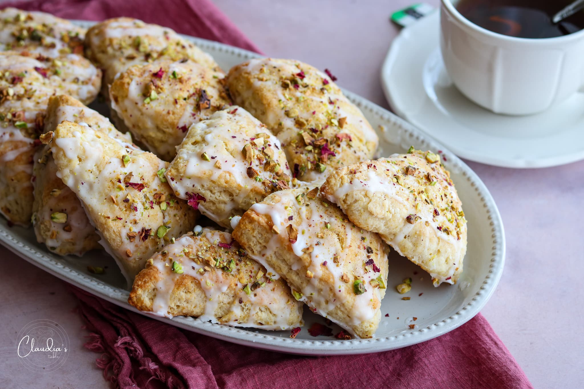 platter of scones with rosewater glaze and toasted pistachios.