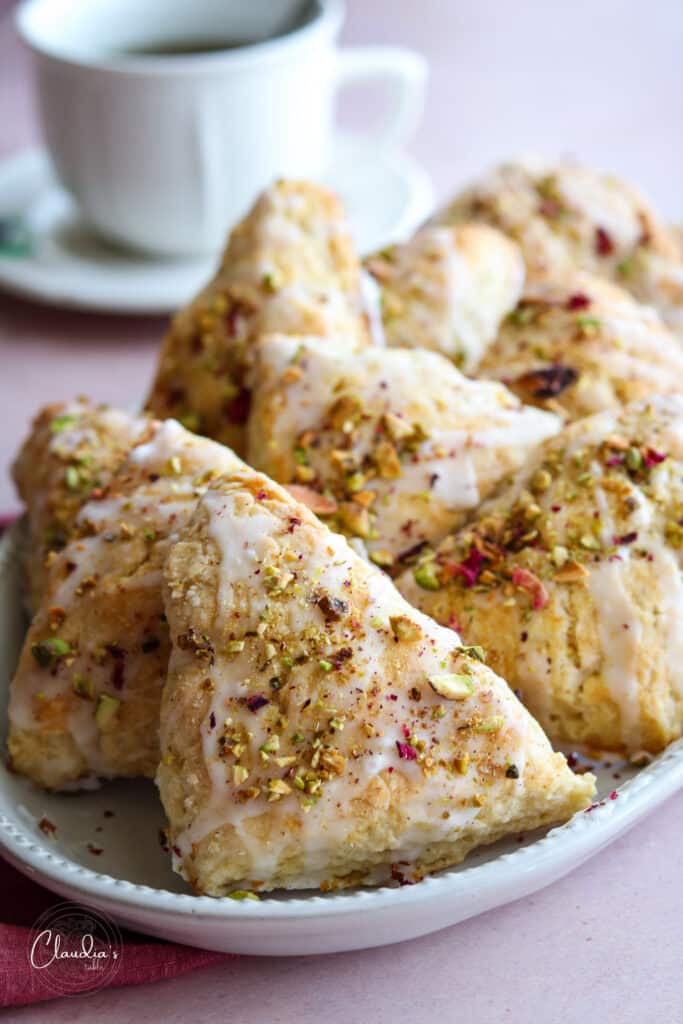 scones with a cup of tea. rosewater glaze and pistachios. 