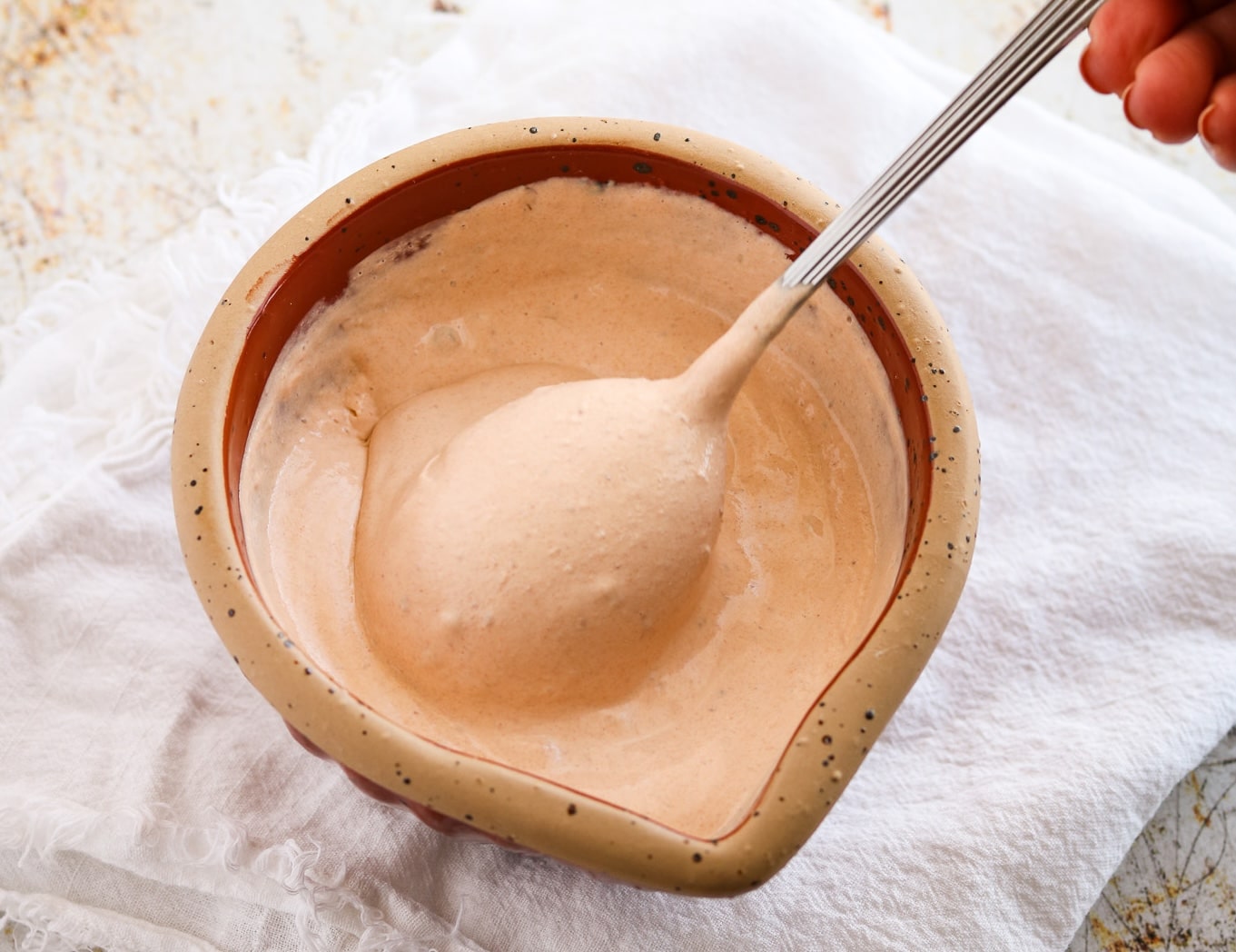 3 ingredient Chipotle Crema in a small bowl with spoon.