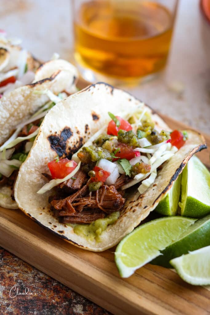 braised brisket tacos with cabbage, pico de Gallo, lime wedges 