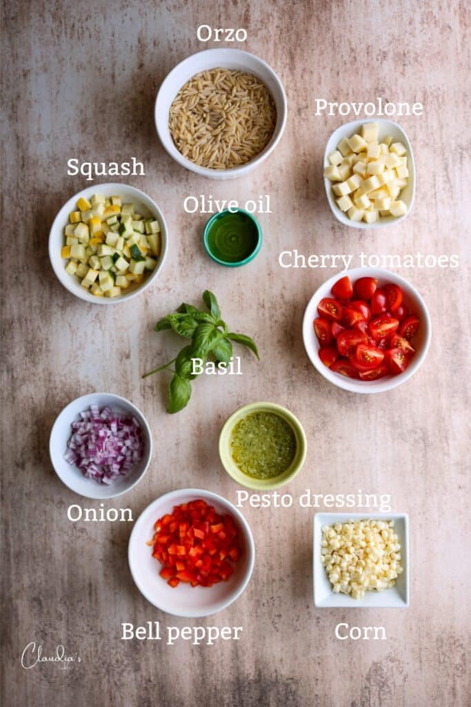 orzo pesto pasta salad ingredients in white bowls 