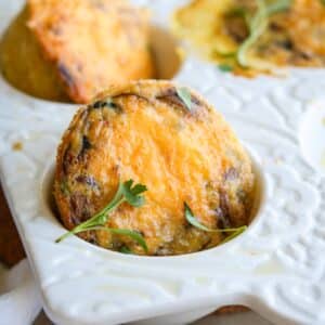 Denver aka Western omelette in egg muffins in a white muffin dish.