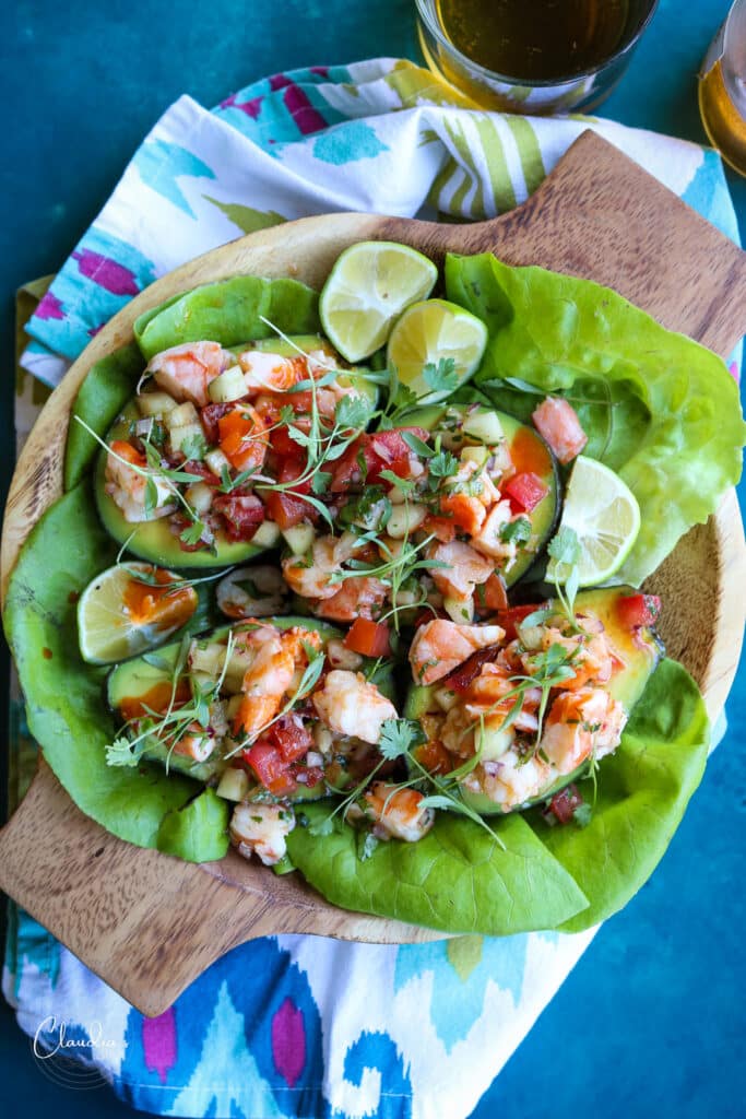 shrimp salad avocado boats served with butter lettuce. 
