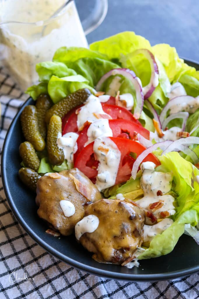 Simple cheeseburger salad with spicy dill pickle ranch dressing.